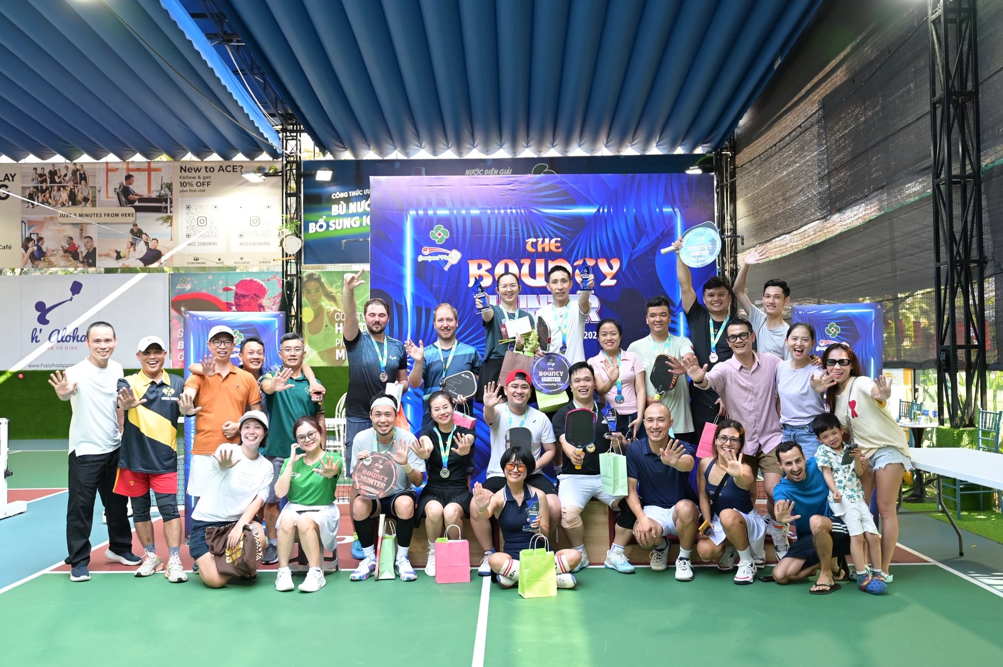 Pickleball tournament participants celebrating at Courtyard Pickle, Da Nang