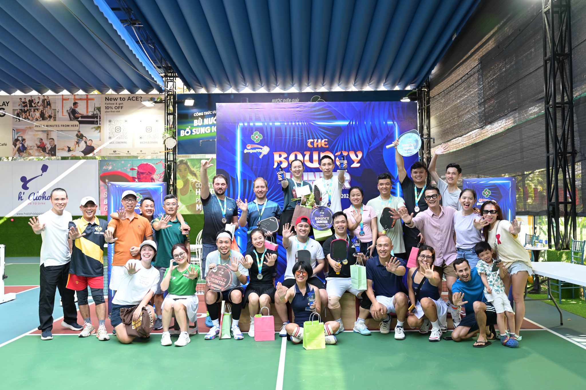 Pickleball tournament participants celebrating at Courtyard Pickle, Da Nang